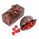 Какао-боб из горького шоколада с драже клубника в белом шоколаде красного цвета